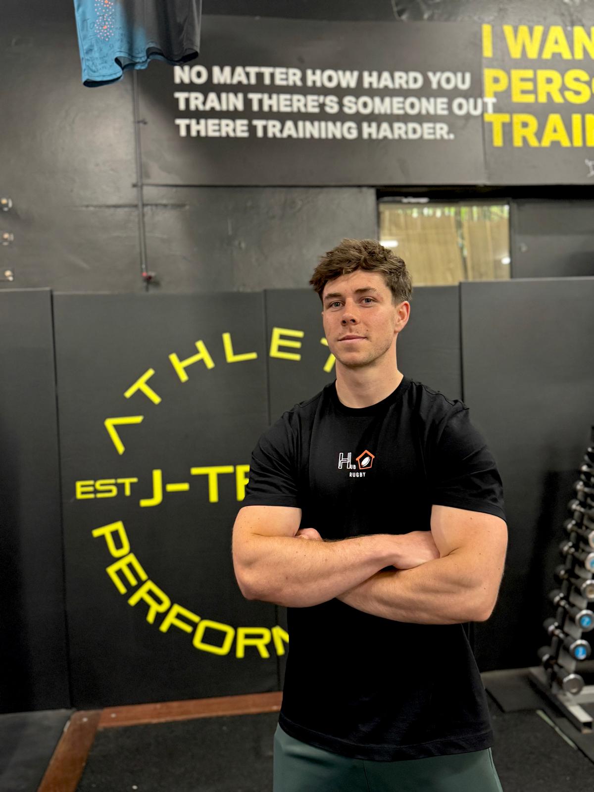 Tom Price wearing a HUB Rugby coaching shirt